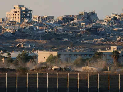 Destroyed buildings following explosions in Gaza, as seen from southern Israel, October 7, 2025. REUTERS/Ammar Awad