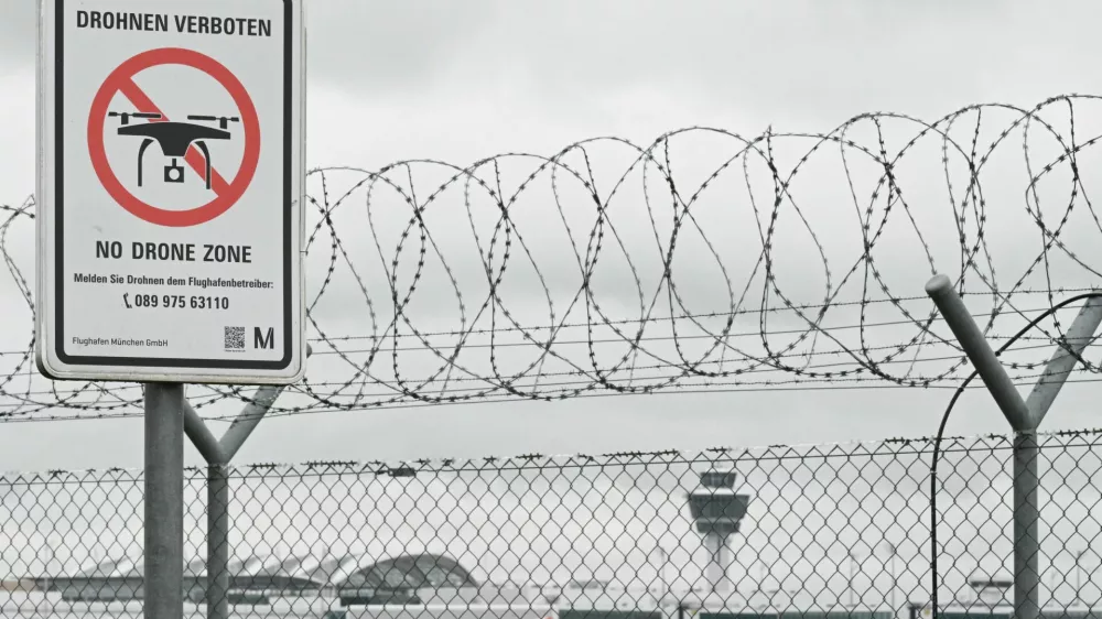 A sign with a drone ban is displayed outside the airport in Munich, Germany October 6, 2025. REUTERS/Angelika Warmuth