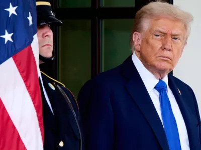 President Donald Trump waits to greet Canada's Prime Minister Mark Carney, as Carney arrives at the White House, Tuesday, Oct. 7, 2025, in Washington. (AP Photo/Jacquelyn Martin)