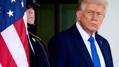 President Donald Trump waits to greet Canada's Prime Minister Mark Carney, as Carney arrives at the White House, Tuesday, Oct. 7, 2025, in Washington. (AP Photo/Jacquelyn Martin)