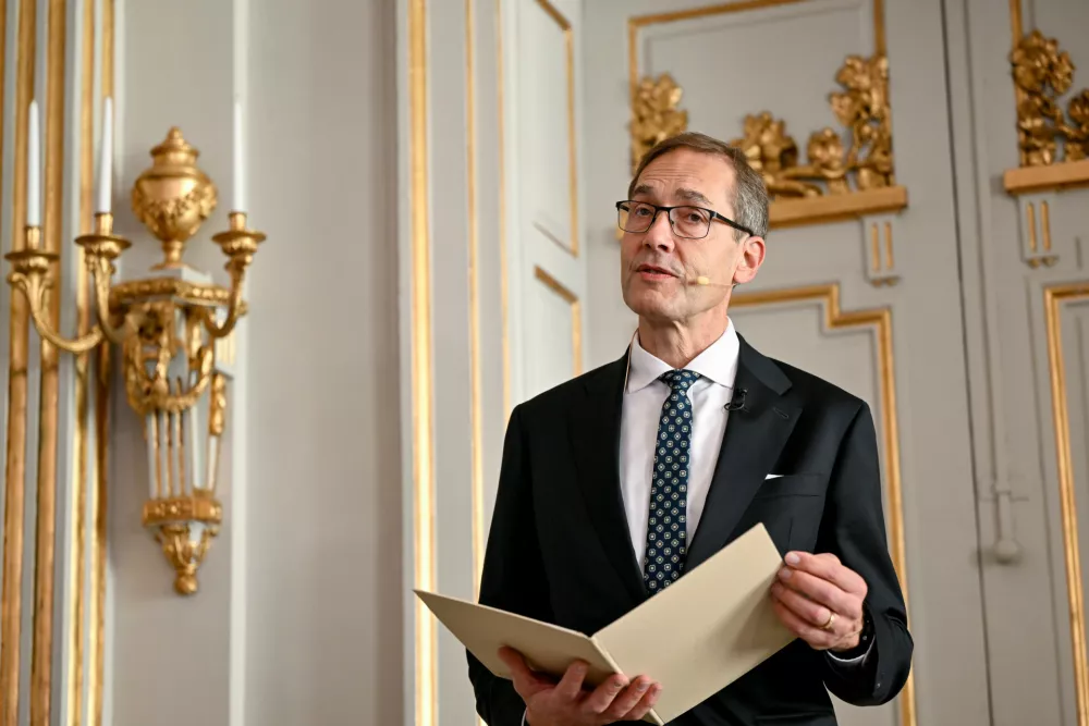 Permanent Secretary and Speaker of the Swedish Academy Mats Malm announces Laszlo Krasznahorkai as the recipient of the Nobel Prize in Literature, at the Nobel Assembly of the Karolinska Institutet, in Stockholm, Sweden, Thursday, Oct. 9, 2025. (Henrik Montgomery/TT News Agency via AP)