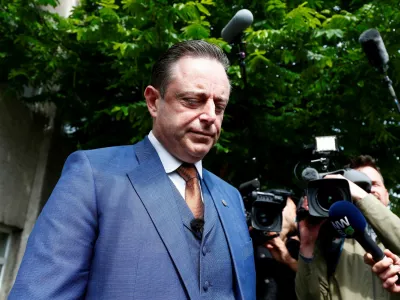 FILE PHOTO: Bart De Wever, President of Flemish nationalist party N-VA, talks to the media after casting his vote for the Belgian general and regional elections and for the European Parliament Elections in Antwerp, Belgium May 26, 2019. REUTERS/Francois Lenoir/File Photo