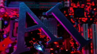 FILE PHOTO: AI (Artificial Intelligence) letters and robot hand are placed on computer motherboard in this illustration created on June 23, 2023. REUTERS/Dado Ruvic/Illustration/File Photo