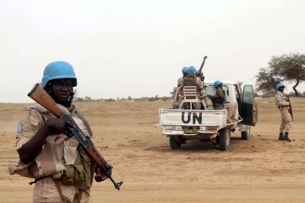 FILE PHOTO: UN peacekeepers stand guard in the northern town of Kouroume, Mali, May 13, 2015. Kourome is 18 km (11 miles) south of Timbuktu. REUTERS/Adama Diarra/File Photo