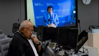 FILE PHOTO: Former Philippine President Rodrigo Duterte is seen on a screen in the courtroom of the International Criminal Court (ICC) with his lawyer Salvador Medialdea seated left, in The Hague, Netherlands, Friday, March 14, 2025. Peter Dejong/Pool via REUTERS//File Photo