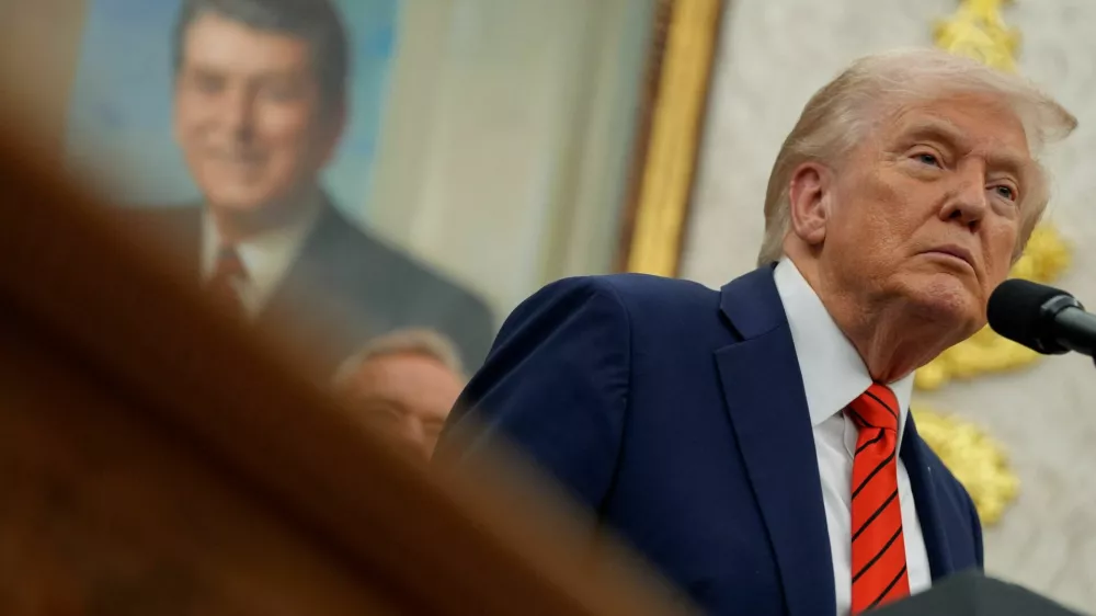 U.S. President Donald Trump looks on during an announcement about lowering U.S. drug prices, at the White House in Washington, D.C., U.S., October 10, 2025. REUTERS/Kent Nishimura