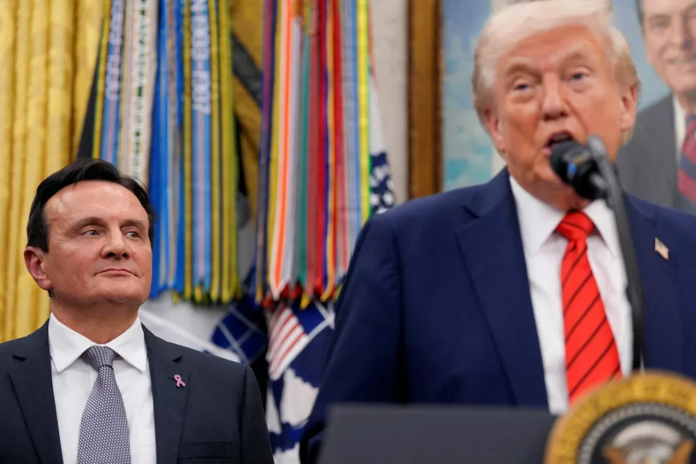 FILE PHOTO: AstraZeneca CEO Pascal Soriot looks at U.S. President Donald Trump during an announcement about lowering U.S. drug prices, at the White House in Washington, D.C., U.S., October 10, 2025. REUTERS/Kent Nishimura/File Photo