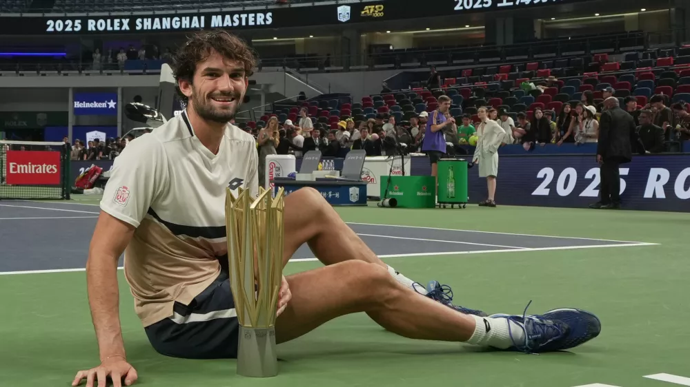 Valentin Vacherot of Monaco poses with trophy after winning the final of the Shanghai Masters tennis tournament defeating Arthur Rinderknech of France at Qizhong Forest Sports City Tennis Center, in Shanghai, China, Sunday, Oct. 12, 2025. (AP Photo/Andy Wong)