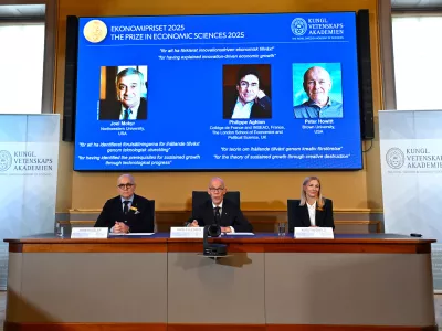 Professor John Hassler, from left, Hans Ellegren, Permanent Secretary of the Academy of Sciences and Professor Kerstin Enflo, announce Joel Mokyr, Philippe Aghion and Peter Howitt as the recipients of the Nobel Memorial Prize in Economics during a press conference at the Royal Swedish Academy of Sciences in Stockholm, Sweden, Monday, Oct. 13, 2025. (Anders Wiklund/TT News Agency via AP)