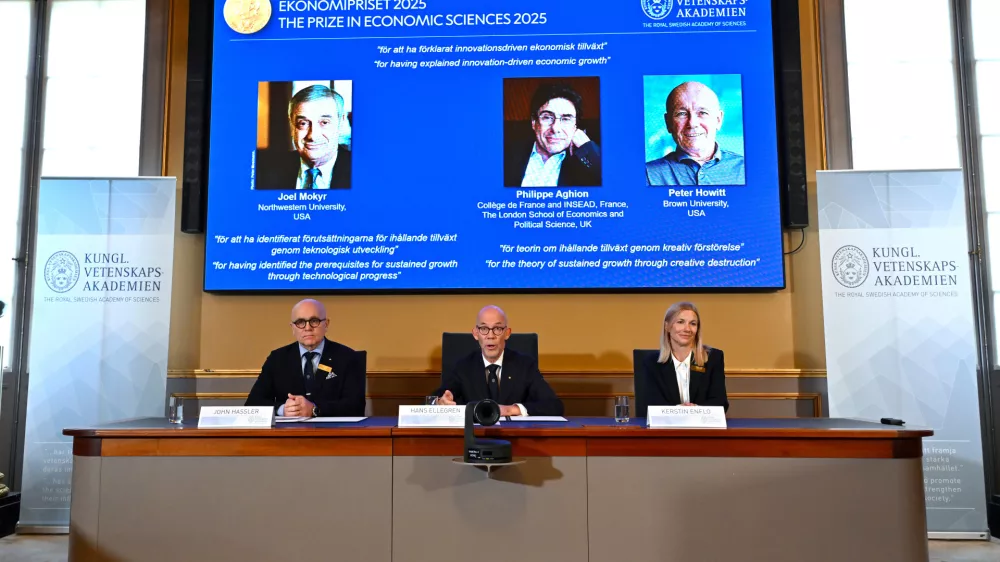Professor John Hassler, from left, Hans Ellegren, Permanent Secretary of the Academy of Sciences and Professor Kerstin Enflo, announce Joel Mokyr, Philippe Aghion and Peter Howitt as the recipients of the Nobel Memorial Prize in Economics during a press conference at the Royal Swedish Academy of Sciences in Stockholm, Sweden, Monday, Oct. 13, 2025. (Anders Wiklund/TT News Agency via AP)