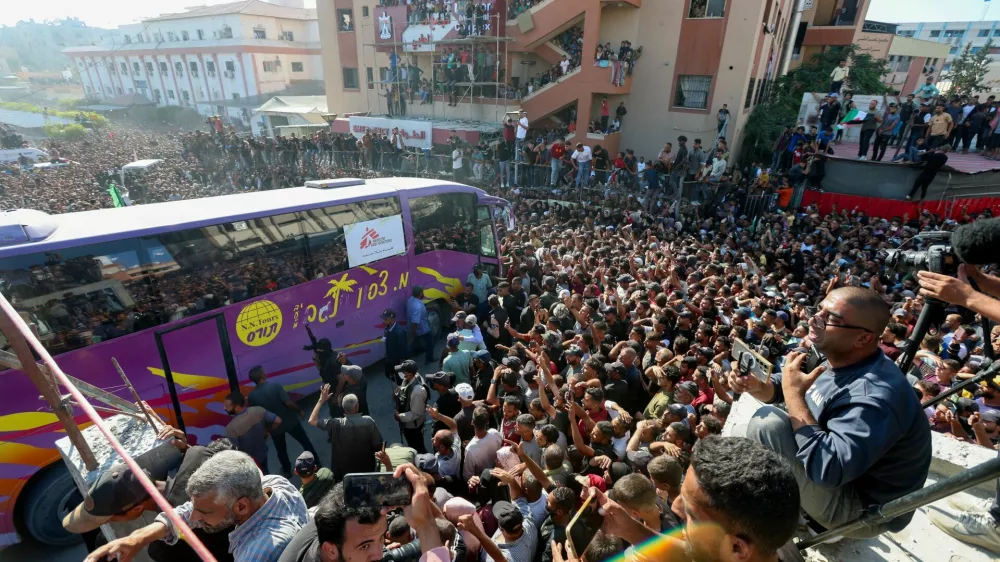 People gather at Nasser hospital as they welcome freed Palestinian prisoners released by Israel as part of a hostages-prisoners swap and a ceasefire deal between Hamas and Israel, in Khan Younis in the southern Gaza Strip, October 13, 2025. REUTERS/Ramadan Abed   TPX IMAGES OF THE DAY