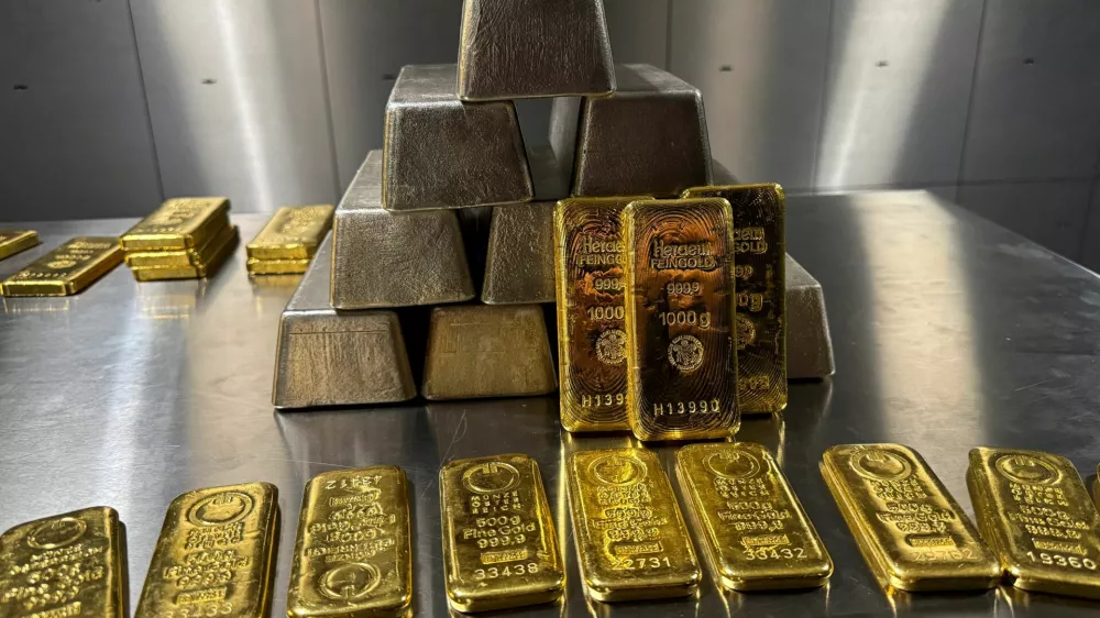 Gold and silver bars are stacked in the safe deposit boxes room of the Pro Aurum gold house in Munich, Germany, October 13, 2025. REUTERS/Angelika Warmuth