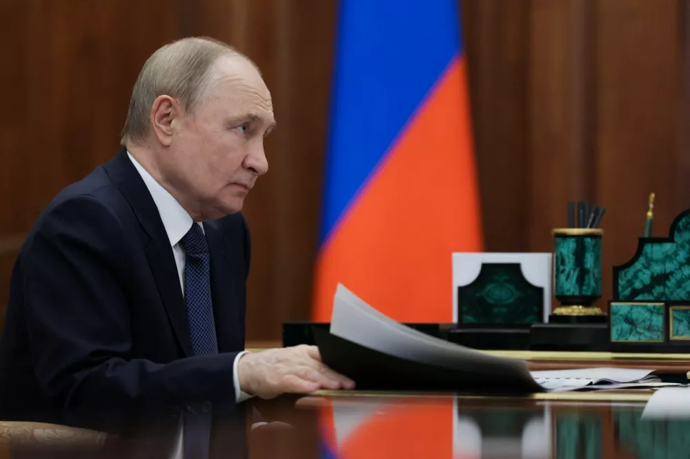 Russian President Vladimir Putin attends a meeting with Ulyanovsk Region Governor Alexei Russkikh at the Kremlin in Moscow, Russia October 13, 2025. Sputnik/Alexander Kazakov/Pool via REUTERS ATTENTION EDITORS - THIS IMAGE WAS PROVIDED BY A THIRD PARTY.