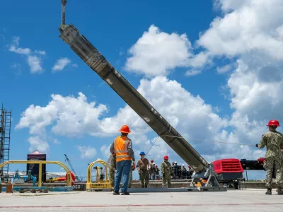 NAVAL BASE GUAM (May 6, 2025) – Sailors assigned to Navy Munitions Command Pacific, East Asia Division, Unit Guam load UGM-109 Tomahawk missiles onto the Los Angeles-class fast-attack submarine USS Jefferson City (SSN 759), May 6, 2025. Assigned to Commander, Submarine Squadron 15 at Polaris Point, Naval Base Guam, Jefferson City is one of five fast-attack submarines forward-deployed in the Pacific. Renowned for their unparalleled speed, endurance, stealth, and mobility, fast-attack submarines serve as the backbone of the Navy's submarine force, ensuring readiness and agility in safeguarding maritime interests around the world. (U.S. Navy photo by Lt. James Caliva),Image: 1017624832, License: Rights-managed, Restrictions:, Model Release: no