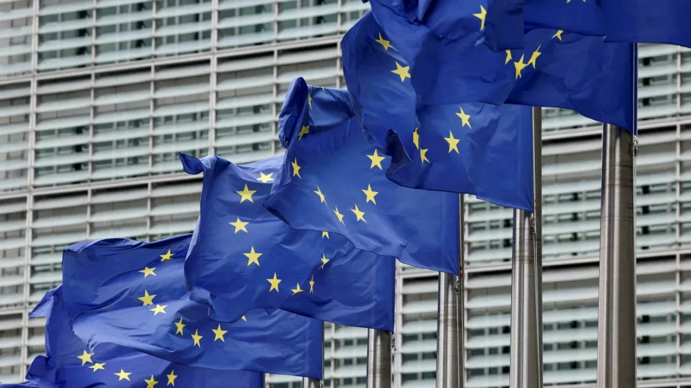 FILE PHOTO: European Union flags flutter outside the EU Commission headquarters in Brussels, Belgium July 16, 2025. REUTERS/Yves Herman//File Photo