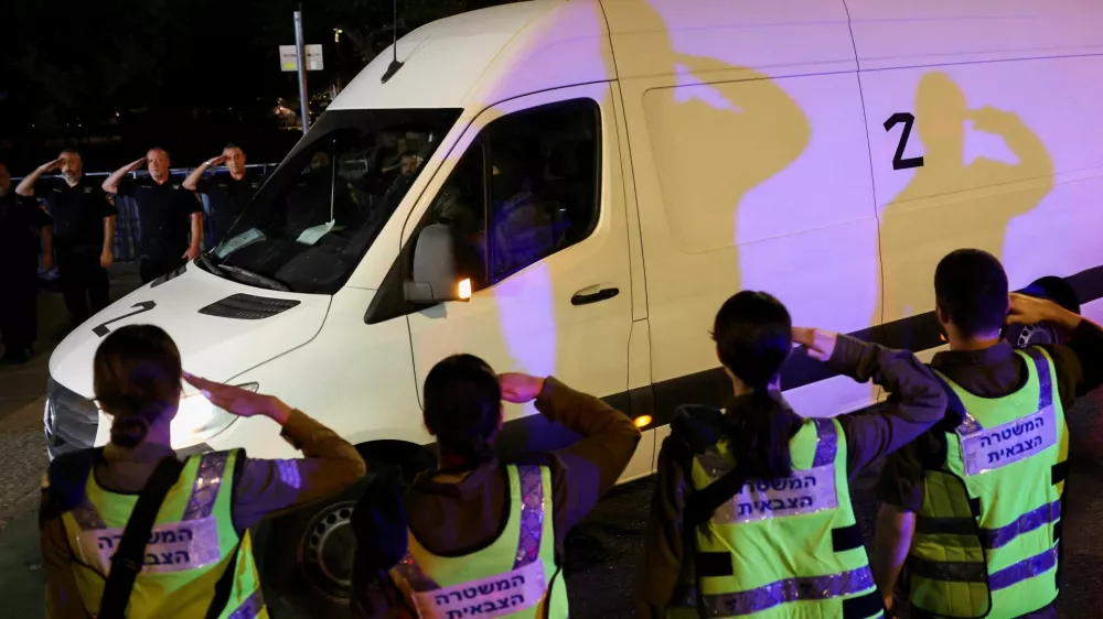 A convoy transporting the bodies of deceased hostages, kidnapped during the deadly October 7, 2023 attack by Hamas, arrives at Abu Kabir forensic centre, as part of a prisoner-hostage swap and a ceasefire deal between Israel and Hamas, in Tel Aviv, Israel October 15, 2025. REUTERS/Stoyan Nenov