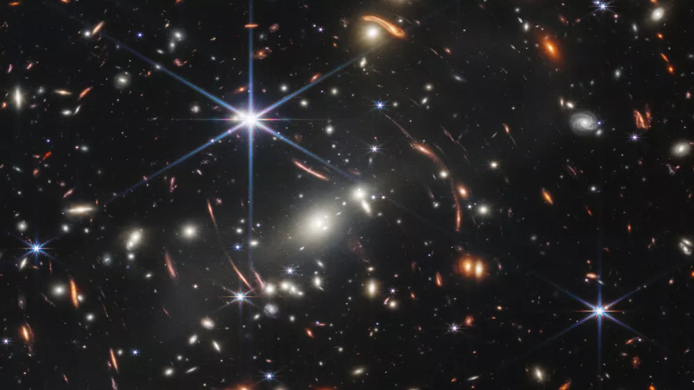 HANDOUT - 12 July 2022, ---, -: An image provided by NASA on 12 July 2022 shows the galaxy cluster SMACS 0723, captured by James Webb Space Telescope. The first image from NASA's new space telescope shows the deepest and sharpest image of the distant universe to date. The image known as Webb's First Deep Field shows galaxy cluster SMACS 0723 and is overflowing with detail. Photo: Space Telescope Science Institut/NASA/ESA/CSA/dpa - ATTENTION: editorial use only and only if the credit mentioned above is referenced in full