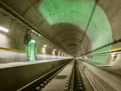 ﻿In this image released on Monday, Apr. 4, 2016, the tracks of the Gotthard Base Tunnel point to the future of the trans-Alpine railway. The Gotthard Base Tunnel, the longest train tunnel in the world, enters into service on 11 December 2016. Prior to this, the record-breaking construction will be more accessible than ever, but only for a limited period. From 2 August 2016, passengers may descend into the once-in-a-century construction on exclusive tunnel rides - disembarkation in the depths of the mountain included. The special Gottardino train only runs until 27 November 2016 and the number of tickets is limited. For more information visit www.apassignments.com/newsaktuell. (Swiss Travel System AG/obs via AP Images)
