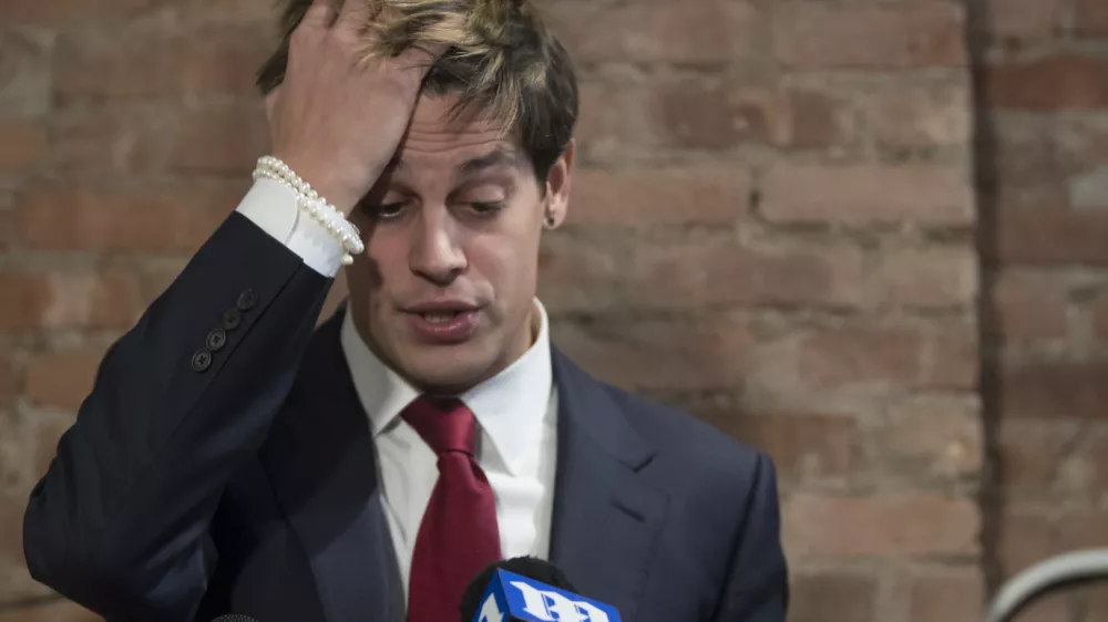 ﻿Milo Yiannopoulos speaks during a news conference, Tuesday, Feb. 21, 2017, in New York. Yiannopoulos has resigned as editor of Breitbart Tech after coming under fire from other conservatives over comments on sexual relationships between boys and older men. (AP Photo/Mary Altaffer)