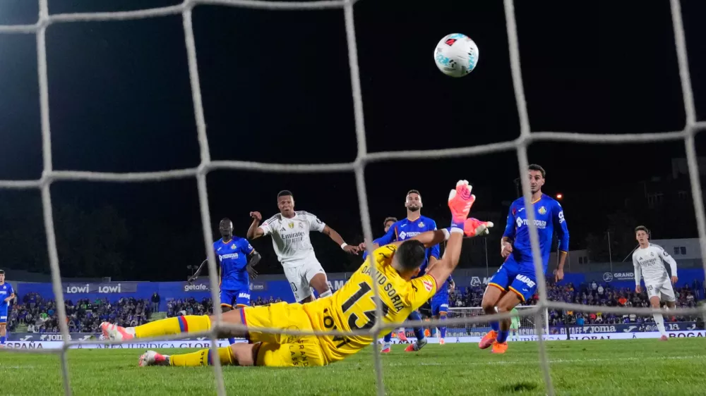 Real Madrid's Kylian Mbappe scores during a La Liga soccer match between Getafe and Real Madrid in Getafe, Spain, Sunday, Oct. 19, 2025. (AP Photo/Manu Fernandez)