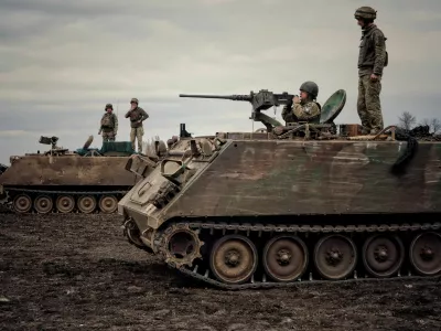 Ukrainian servicemen train to shoot a machine gun from M113 Armoured Personnel Carrier (APC) during a training session, amid Russia's invasion of Ukraine, in Donbas region, Ukraine April 8, 2023. REUTERS/Yan Dorbronosov