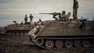 Ukrainian servicemen train to shoot a machine gun from M113 Armoured Personnel Carrier (APC) during a training session, amid Russia's invasion of Ukraine, in Donbas region, Ukraine April 8, 2023. REUTERS/Yan Dorbronosov