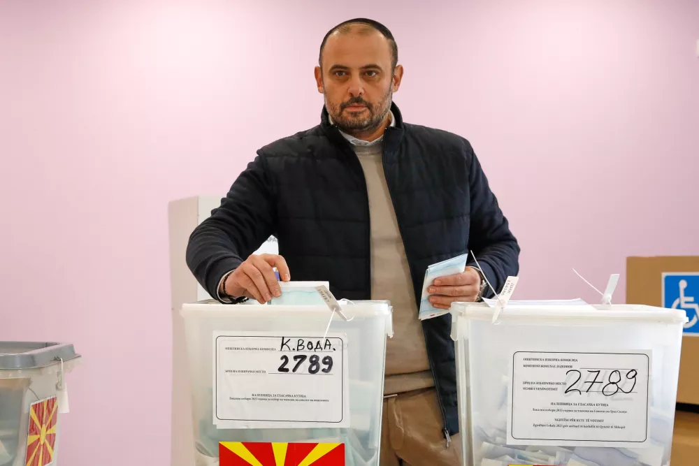 Orce Gjorgjievski, a candidate for a mayor of Skopje from the ruling conservative VMRO-DPMNE party, casts his ballots in the first round of the local elections, at a polling station in Skopje, North Macedonia, on Sunday, Oct. 19, 2025. (AP Photo/Boris Grdanoski)