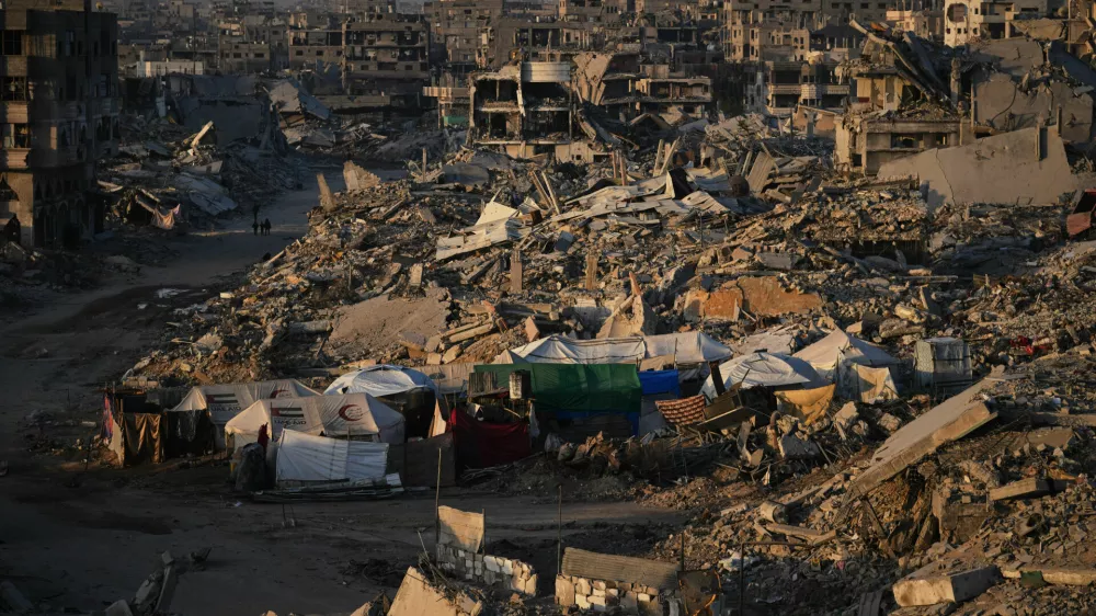 Tents for displaced Palestinians stand amid the destruction caused by the Israeli air and ground offensive in Sheikh Radwan neighborhood in Gaza City, Wednesday, Oct. 22, 2025. (AP Photo/Abdel Kareem Hana)