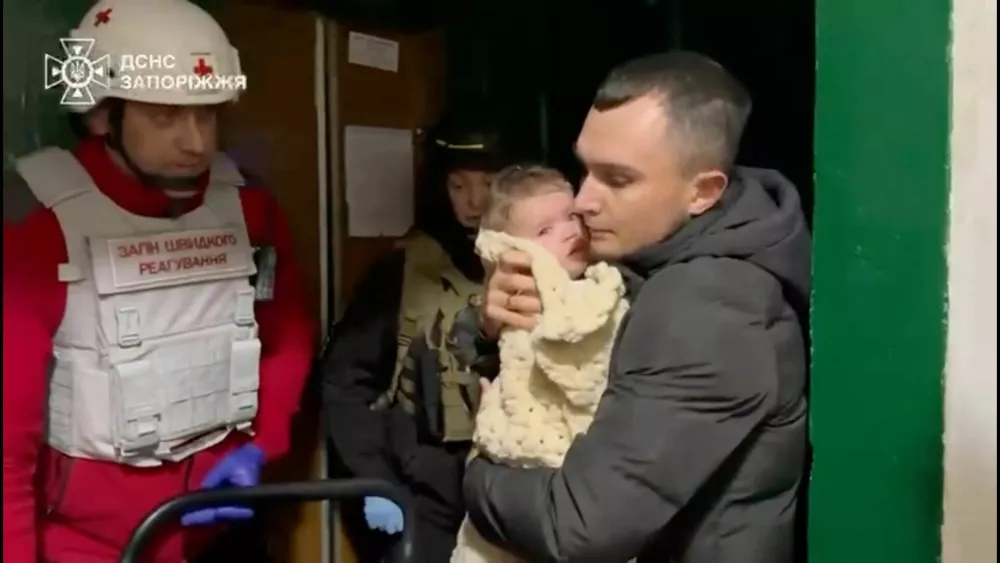 Emergency workers evacuate residents from the site of a Russian strike, amid Russia's attack on Ukraine, in a location given as Zaporizhzhia, Ukraine, in this screengrab from a video released on October 22, 2025. State Emergency Service Of Ukraine In Zaporizhzhia Region/Handout via REUTERS  THIS IMAGE HAS BEEN SUPPLIED BY A THIRD PARTY. MANDATORY CREDIT. VERIFICATION: Reuters was not able to independently verify the location or the date when the footage was filmed.