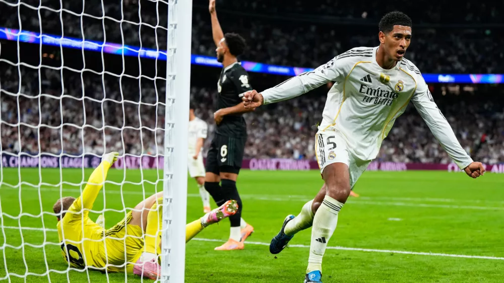 Real Madrid's Jude Bellingham celebrates after scoring his sides first goal during the Champions League opening phase soccer match between Real Madrid and Juventus in Madrid, Spain, Wednesday, Oct. 22, 2025. (AP Photo/Manu Fernandez)