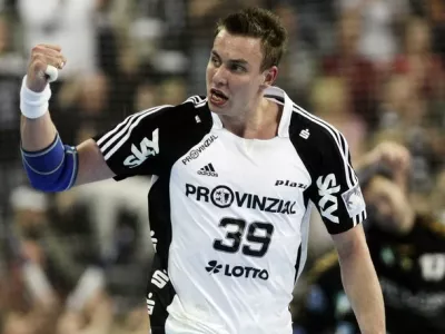 THW Kiel's Filip Jicha celebrates scoring during the first-leg EHF Champions League semi-final match in the northern German city of Kiel on April 26, 2009. THW Kiel won the match 37-23. AFP PHOTO DDP / ROLAND MAGUNIA GERMANY OUT (Photo credit should read ROLAND MAGUNIA/AFP/Getty Images)