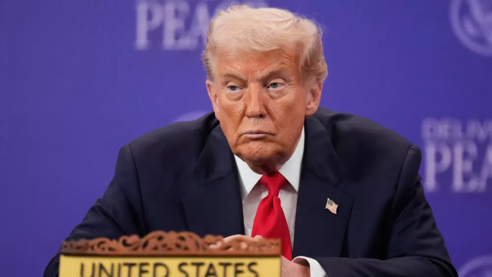 President Donald Trump reacts during a signing ceremony on the sidelines of the ASEAN Summit in Kuala Lumpur, Malaysia, Sunday, Oct. 26, 2025. (AP Photo/Mark Schiefelbein)