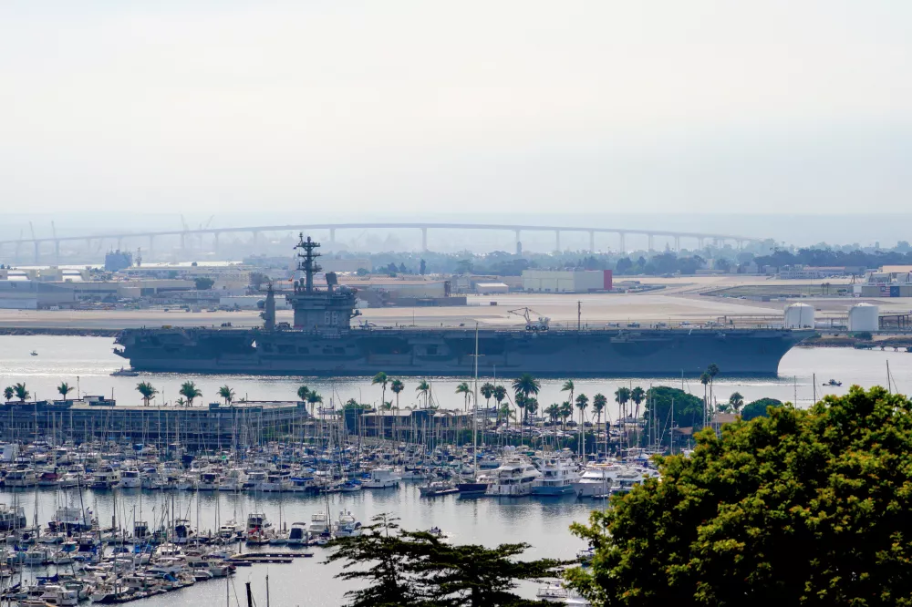 FILE - The USS Nimitz (CVN 68) departs San Diego Bay, Aug. 19, 2023, at Mission Beach, in San Diego. (Nelvin C. Cepeda/The San Diego Union-Tribune via AP, File)