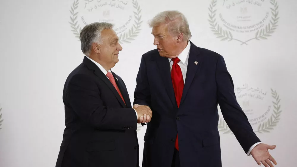FILE PHOTO: U.S. President Donald Trump and Hungary's Prime Minister Viktor Orban shake hands as they pose for a photo, at a world leaders' summit on ending the Gaza war in Sharm el-Sheikh, Egypt, October 13, 2025. Yoan Valat/Pool via REUTERS/File Photo