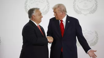 FILE PHOTO: U.S. President Donald Trump and Hungary's Prime Minister Viktor Orban shake hands as they pose for a photo, at a world leaders' summit on ending the Gaza war in Sharm el-Sheikh, Egypt, October 13, 2025. Yoan Valat/Pool via REUTERS/File Photo