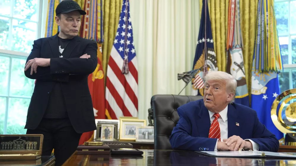 FILE - President Donald Trump, right, speaks during a news conference with Elon Musk in the Oval Office of the White House, in Washington, May 30, 2025,. (AP Photo/Evan Vucci, File)