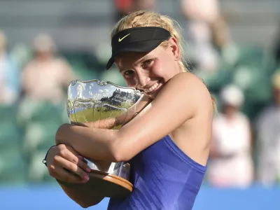 ﻿Croatia's Donna Vekic celebrates winning the women's finall on day seven of the Nottingham Open at Nottingham Tennis Centre, England, Sunday June 18, 2017. (Joe Giddens/PA via AP)
