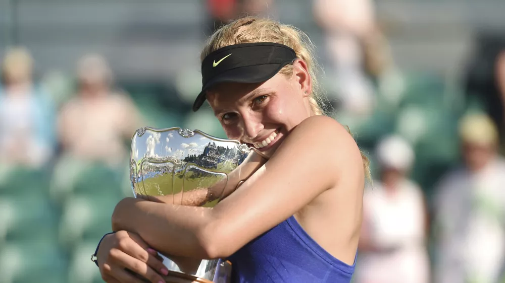 ﻿Croatia's Donna Vekic celebrates winning the women's finall on day seven of the Nottingham Open at Nottingham Tennis Centre, England, Sunday June 18, 2017. (Joe Giddens/PA via AP)