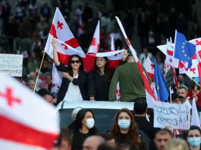 FILE PHOTO: Opposition supporters attend a rally on the day of local elections in Tbilisi, Georgia October 4, 2025. REUTERS/Irakli Gedenidze/File Photo