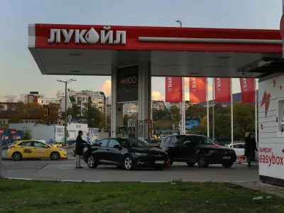 A person is seen refueling a car at a Lukoil petrol station Lukoil in Sofia, Bulgaria, Tuesday, Oct. 28, 2025. (AP Photo/ Valentina Petrova)