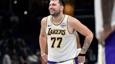 Los Angeles Lakers guard Luka Doncic (77) reacts in the second half of an NBA Cup basketball game against the Memphis Grizzlies Friday, Oct. 31, 2025, in Memphis, Tenn. (AP Photo/Brandon Dill)