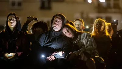 People flash mobile phone lights during a 16 minutes of silence, on the first anniversary of the fatal November 2024 Novi Sad railway station canopy collapse, which killed 16 people, triggering nationwide accusations of widespread corruption and negligence, in Novi Sad, Serbia, November 1, 2025. REUTERS/Marko Djurica