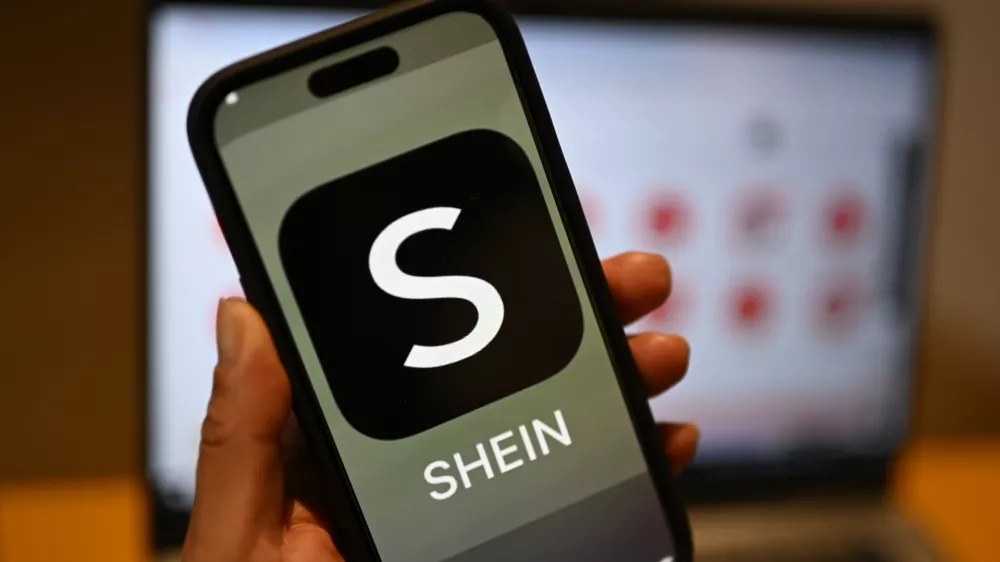 FILED - 29 April 2024, Berlin: The Shein logo can be seen on a smartphone. The European Commission on Monday urged online retailer Shein to respect European Union consumer protection law after an investigation by national authorities found several breaches. Photo: Monika Skolimowska/dpa