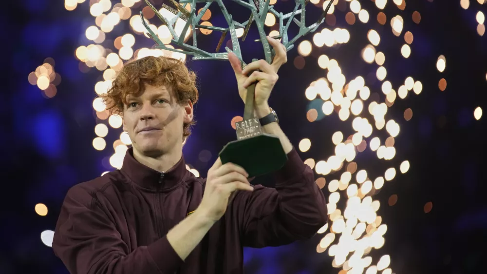 Italy's Jannik Sinner holds the trophy after winning the final match of the Paris Masters tennis tournament against Canada's Felix Auger-Aliassime in Paris, Sunday, Nov. 2, 2025. (AP Photo/Christophe Ena)