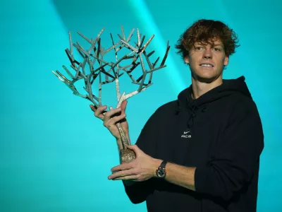 Italy's Jannik Sinner holds the trophy after winning the final match of the Paris Masters tennis tournament against Canada's Felix Auger-Aliassime in Paris, Sunday, Nov. 2, 2025. (AP Photo/Christophe Ena)