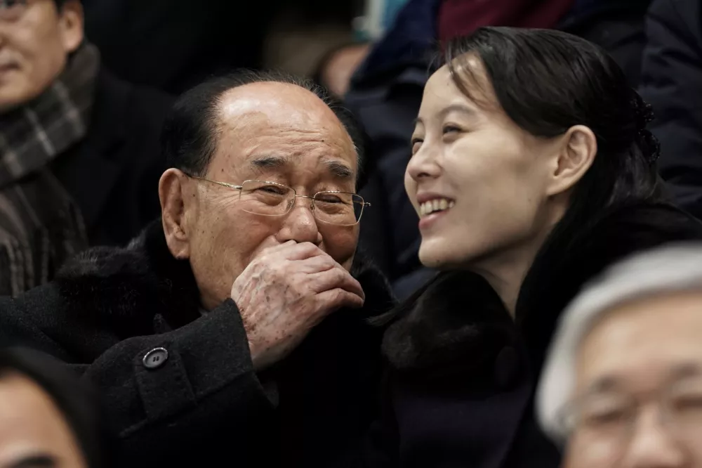 FILE - Kim Yo Jong, sister of North Korean leader Kim Jong Un, right, and North Korea's nominal head of state Kim Yong Nam, talk before the start of the preliminary round of the women's hockey game between Switzerland and the combined Koreas at the 2018 Winter Olympics in Gangneung, South Korea, Feb. 10, 2018. (AP Photo/Felipe Dana, File)