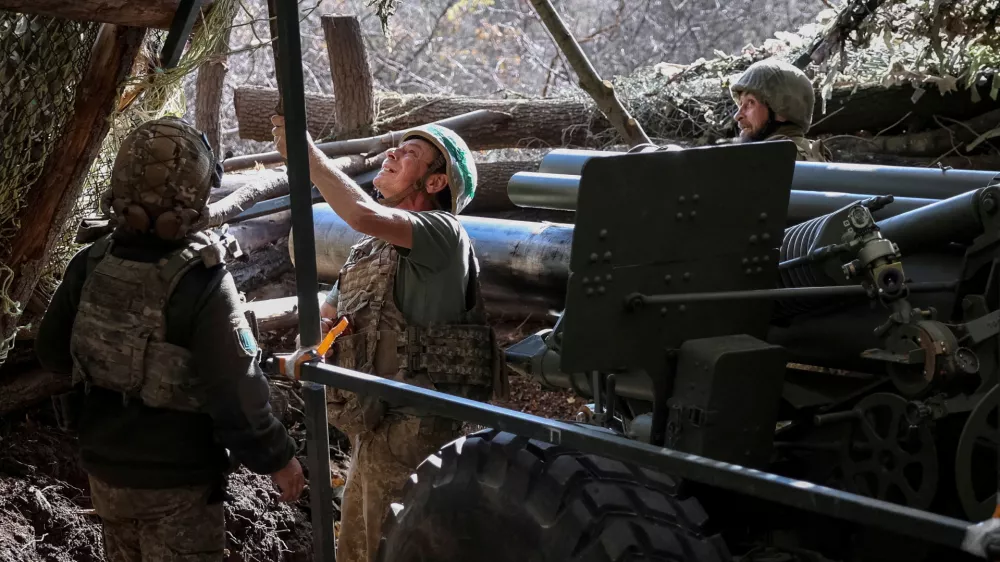 FILE PHOTO: Artillerymen of the 152nd Separate Jaeger Brigade prepare to fire an M114 self-propelled howitzer towards Russian troops, amid Russia's attack on Ukraine, near the frontline town of Pokrovsk in Donetsk region, Ukraine October 15, 2025. REUTERS/Anatolii Stepanov/File Photo