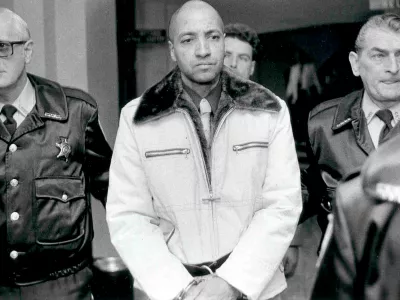 FILE - Convicted killer George Banks, center, is led through the Luzerne County, Pa. courthouse, on the way to his sentencing on Nov. 22, 1985. (Clark Van Orden/The Times Leader via AP, File)