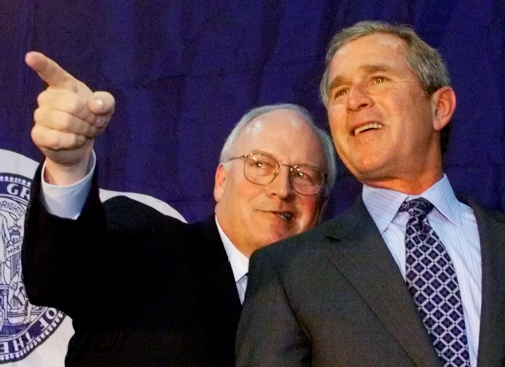 FILE PHOTO: Republican vice presidential candidate Dick Cheney (L) points out something to Texas Governor and Republican presidential candidate George W. Bush during a campaign stop July 26, 2000 in Casper, Wyoming, Cheney's home state.  REUTERS/Jeff Mitchell/File Photo