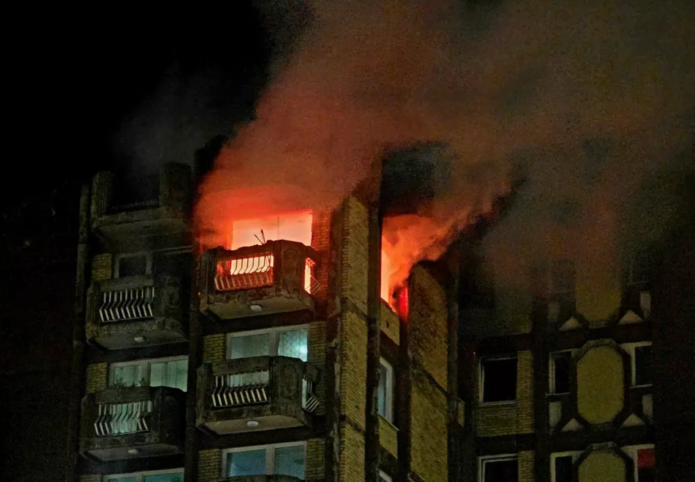 Flames rise as a fire burns at an elderly people's home, in the town of Tuzla, Bosnia and Herzegovina, November 4, 2025. REUTERS/Mersiha Bajric NO RESALES. NO ARCHIVES